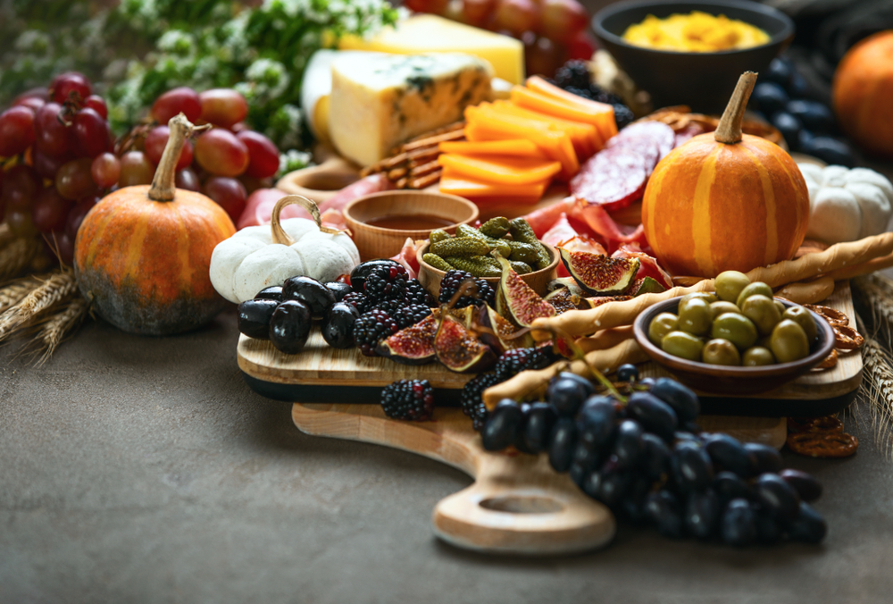 Fall party dinner table with charcuterie board, front view