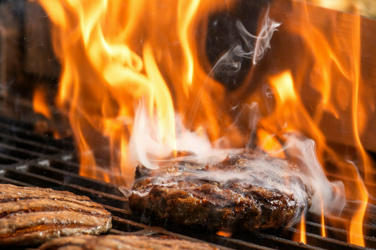 hamburgers cooking hamburgers on grill with flames. beef steak on the grill with flames. barbecue burgers for hamburger prepared grilled on bbq fire flame grill; Shutterstock ID 547881805